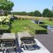terras in blauwsteen met kleiklinker vijver landelijke tuin